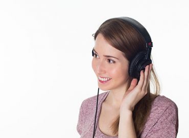 a lady listening with a headset