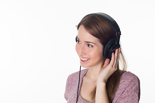 a lady listening with a headset
